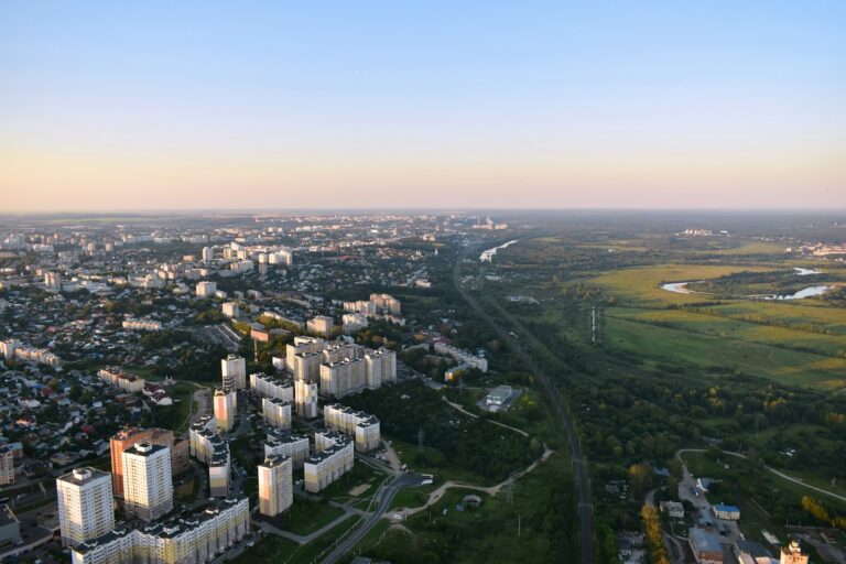 an aerial view of a city with tall buildings